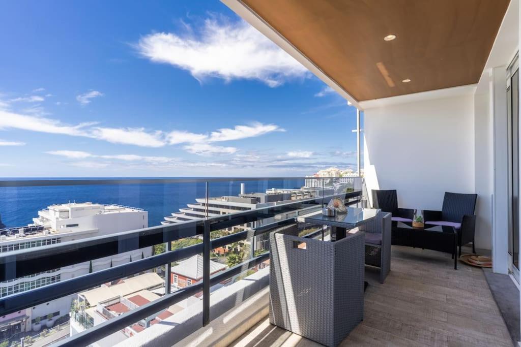 a balcony with a view of the ocean at Monumental Apartments - Multi Listing in Funchal