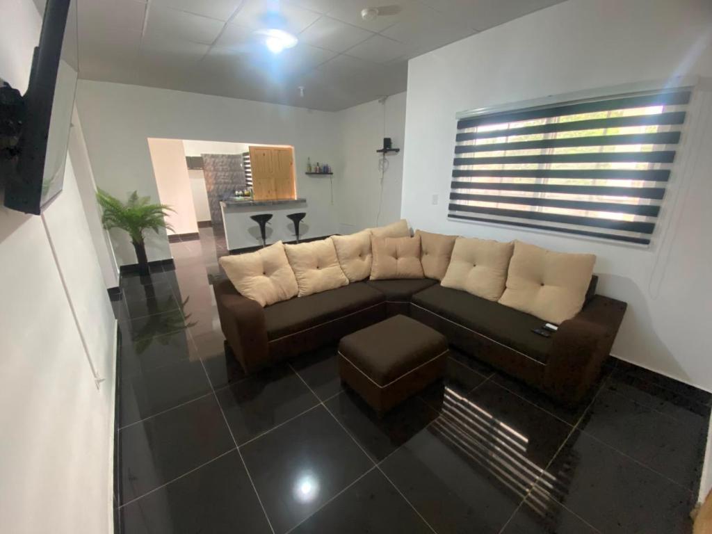 a living room with a couch and a table at Casa playa el Retén 