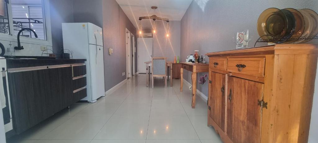 a kitchen with a sink and a counter top at Cantinho das Orquídeas! in Pelotas