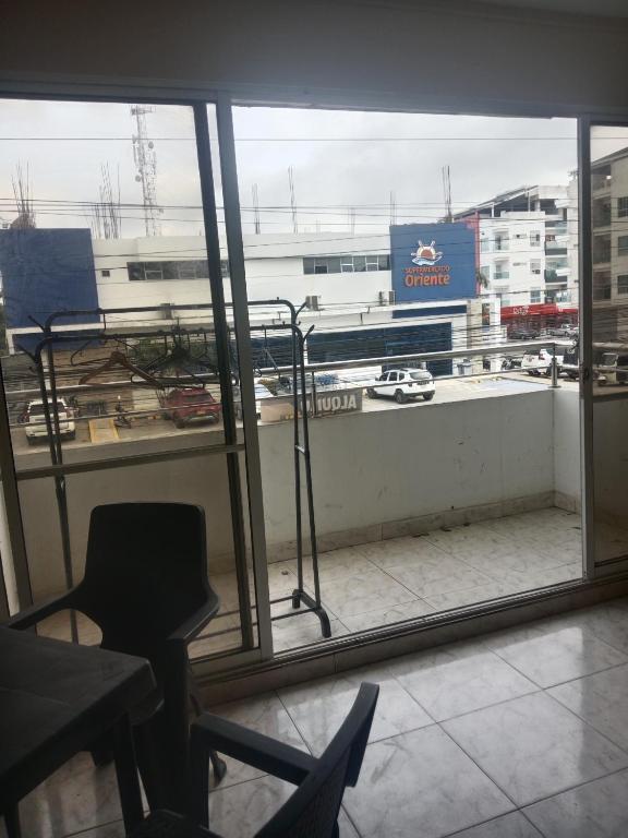 a room with a window with a view of a city at Apartamento centro oriente in Coveñas