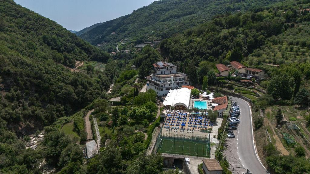 an aerial view of a swimming pool in a mountain at Hotel Lago Bin in Rocchetta Nervina