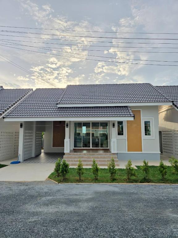 a house with a roof at Tasowa House in Chiang Rai