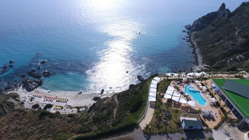 an aerial view of a beach and the ocean at Blue Bay Resort in Capo Vaticano