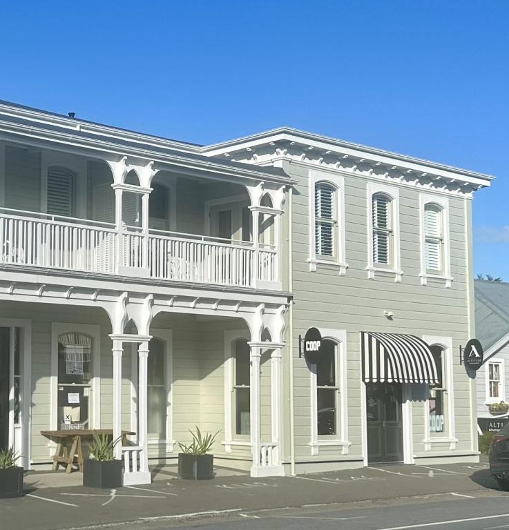 a large house with a balcony on top of it at Altitude Studio in Martinborough