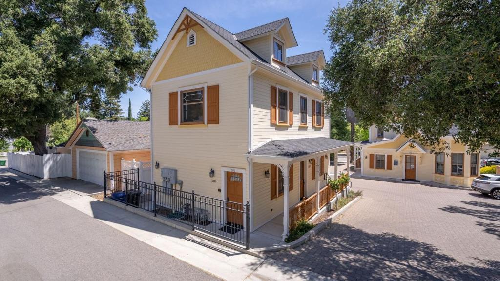 a large white house on a street at Lewis Loft by AvantStay in Paso Robles