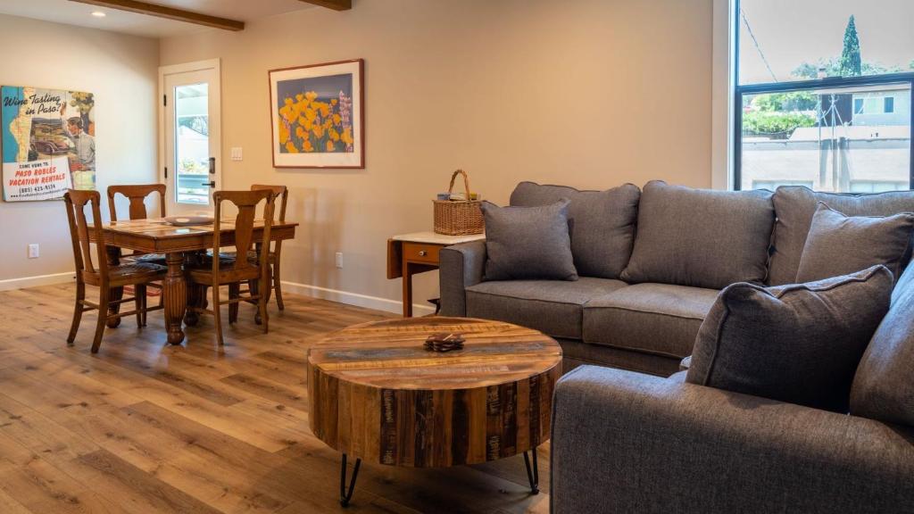 a living room with a couch and a table at The Top Shelf by AvantStay in Paso Robles