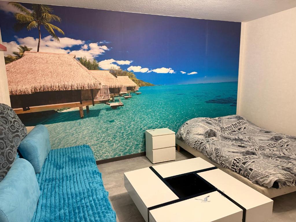a room with a mural of the ocean at Ocean 300m Gare Centre ville Wifi Parking gratuit in Belfort