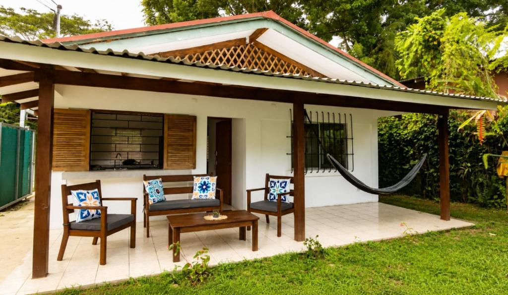 a patio with chairs and a gazebo at La Casita de Yan in Puerto Viejo