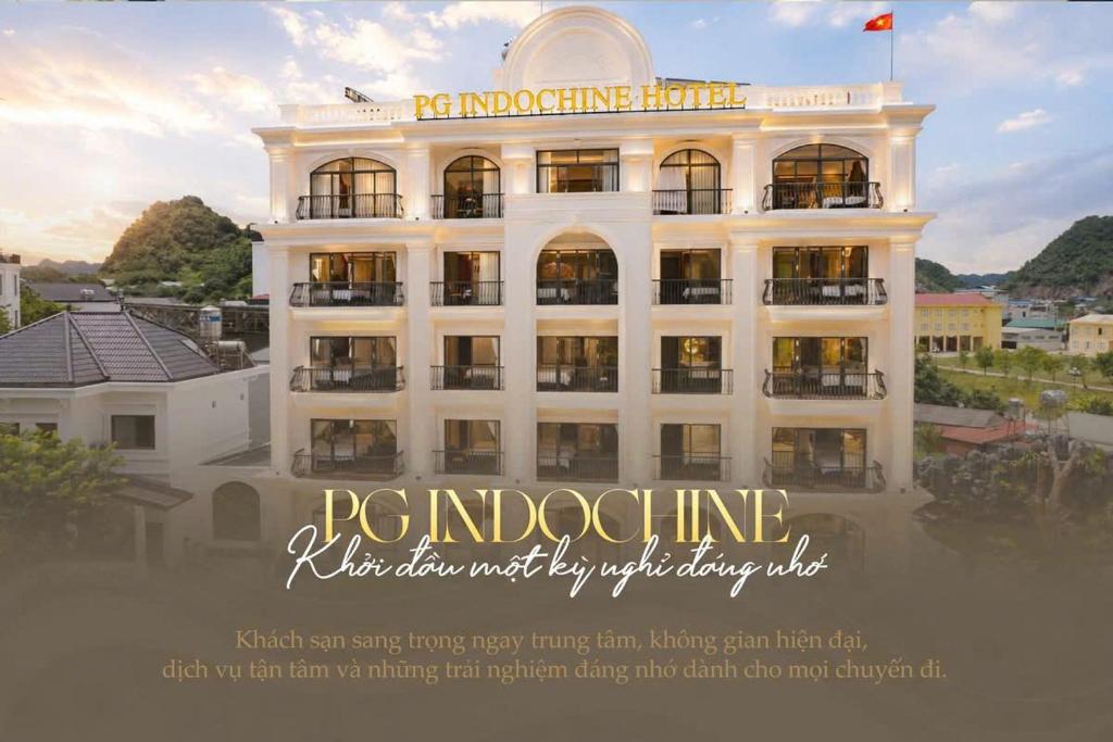 a large white building with the words roostingine next to it at PG indochine Mộc Châu in Sơn La