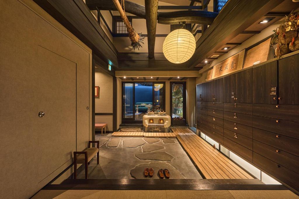 a hallway with a room with a table in it at Wakasa Annex in Nara