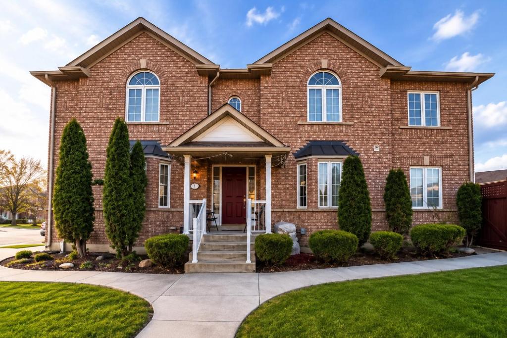 a brick house with trees in front of it at one bedroom in Brampton in Brampton