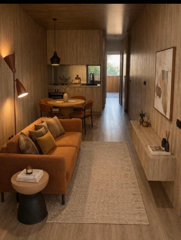 a living room with a couch and a table at K204 junto à Universidade in Guimarães