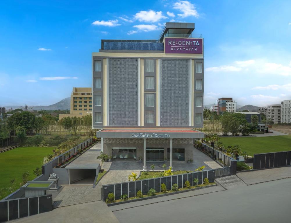 a building with a sign that reads the garden hotel at Regenta Devarayah Tirupati in Tirupati