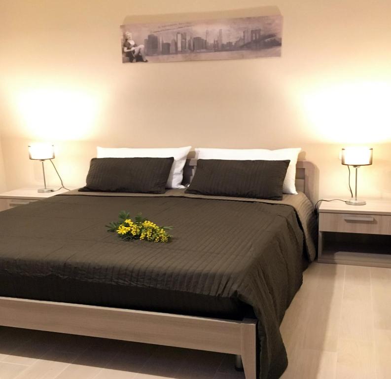 Postel nebo postele na pokoji v ubytování B&B Rossini