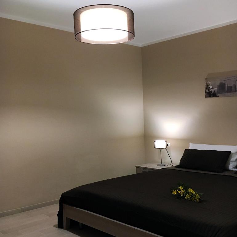 Postel nebo postele na pokoji v ubytování B&B Rossini