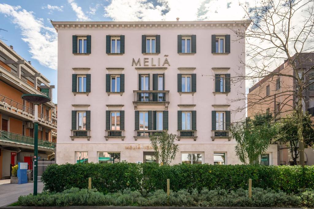 a white building with the words melia on it at Meliá Venezia Lido in Venice-Lido