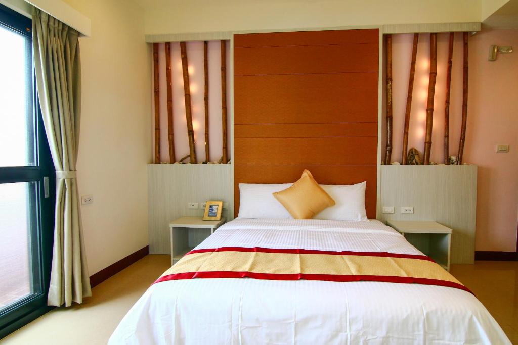 Postel nebo postele na pokoji v ubytování Penghu Luna Sea Homestay