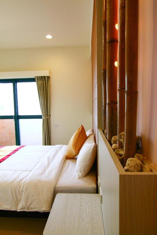 Postel nebo postele na pokoji v ubytování Penghu Luna Sea Homestay