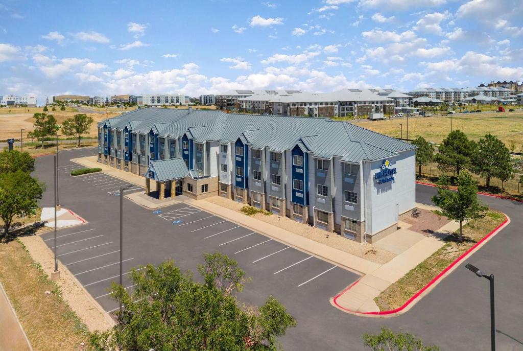 an overhead view of a building in a parking lot at Microtel Inn & Suites by Wyndham Denver Airport in Montbello