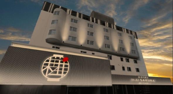 a large white building with a red heart on it at Hotel MAISAKURA MIYABI in Nara