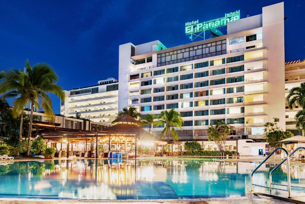 a hotel with a swimming pool in front of a building at Hotel El Panama by Faranda Grand, a member of Radisson Individuals in Panama City