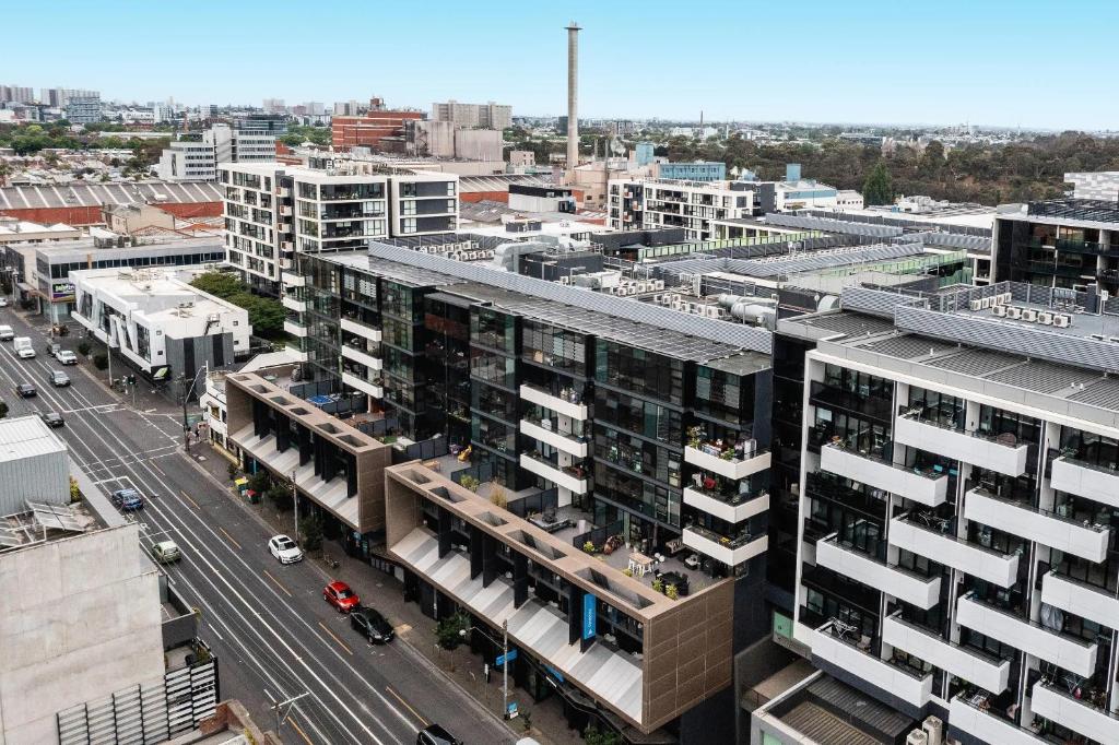 an aerial view of a city with buildings at MainStay Suites Abbotsford in Melbourne