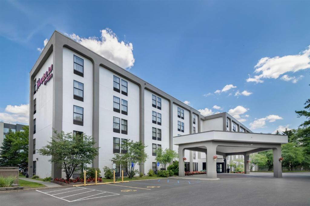 a rendering of a hotel with a parking lot at Hampton Inn Albany-Wolf Road in Albany