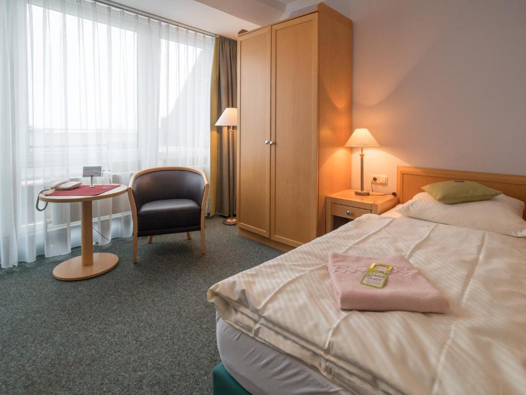 Postel nebo postele na pokoji v ubytování Hotel Spiekeroog