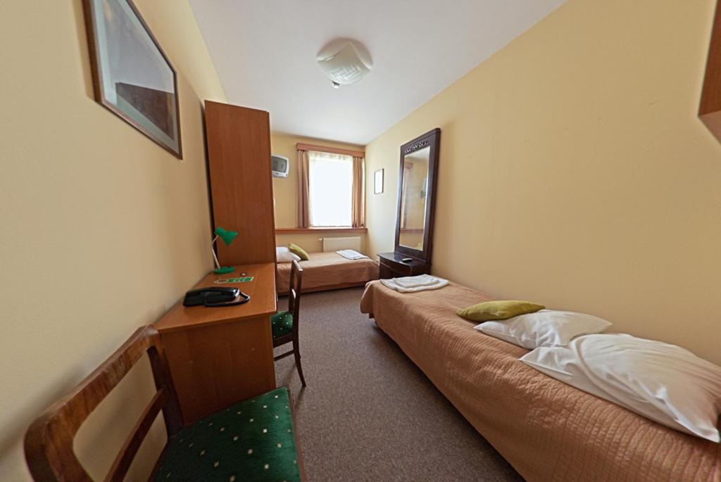 Posteľ alebo postele v izbe v ubytovaní Hotel Alef