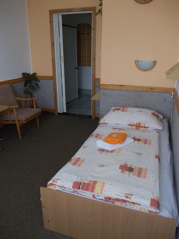 Postel nebo postele na pokoji v ubytování Hotel Milotel