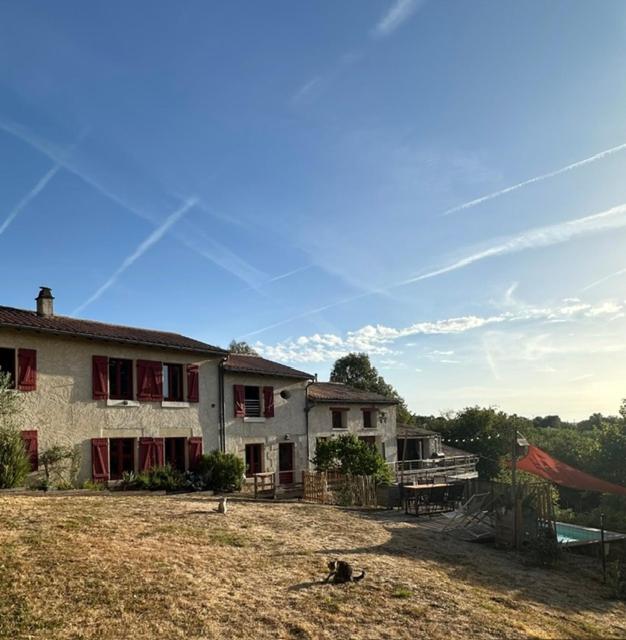 a large house with a yard and a house at Logis de Rault in Sainte-Ouenne