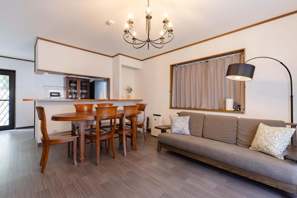 a living room with a couch and a table at N-Stream Old Karuizawa West in Karuizawa