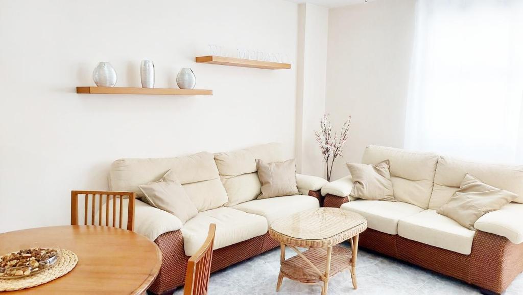 a living room with a couch and a table at Centric 2 bedrooms Apartment near to the beach - newly renovated bathroom and bedrooms - by TENERIFEHINTS in El Médano