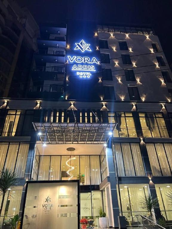 a building with a sign on the front of it at Vora Addis Hotel in Addis Ababa