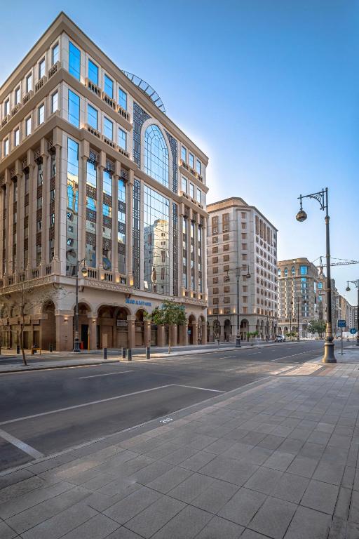an empty street in front of a large building at Bosphorus Hotel Grand Safi in Medina