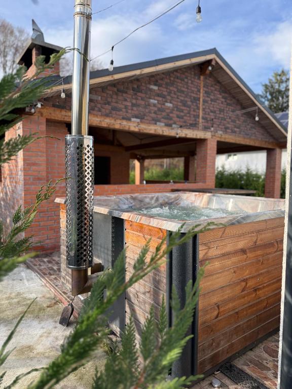 a hot tub in the backyard of a house at Cabana 1407 Valea Avrigului in Avrig
