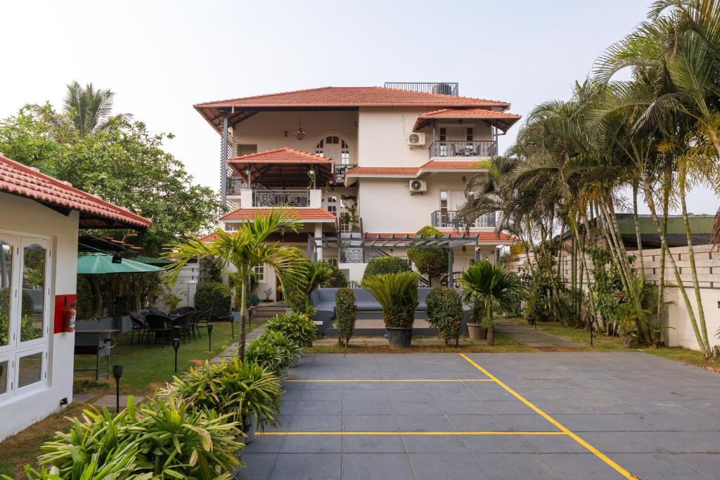 a view of the hotel from the parking lot at The Elegant homes in Kushālnagar