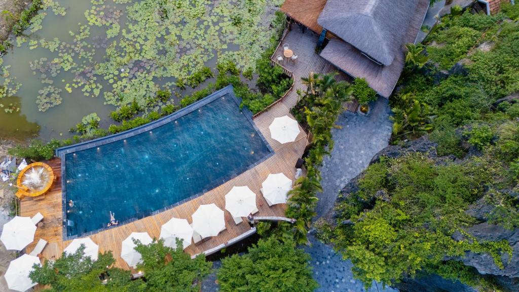 an overhead view of a swimming pool next to a house at Karsia Retreat Ninh Binh in Ninh Binh
