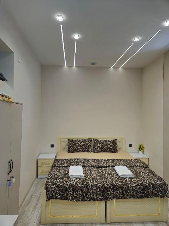 a bedroom with a large bed in a room at БорБор in Osh