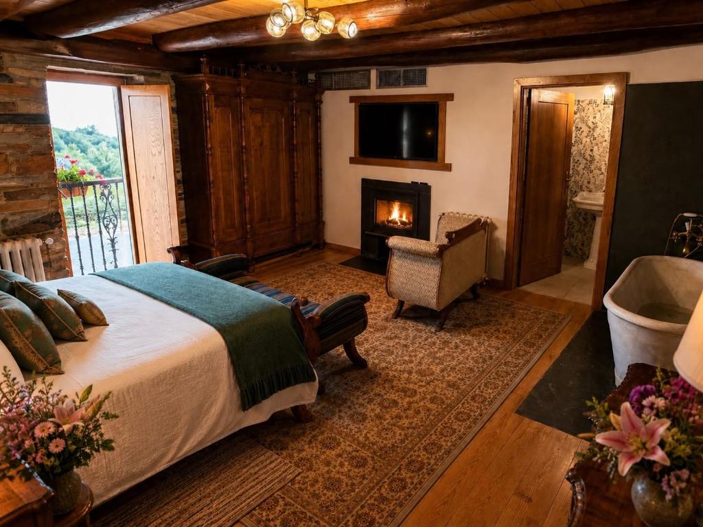 a bedroom with a bed and a fireplace and a television at Casa de Aira Padron 