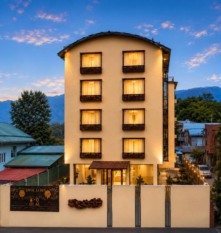 a hotel with a building in the foreground at Saffron by Stay Pattern - City Center in Srinagar