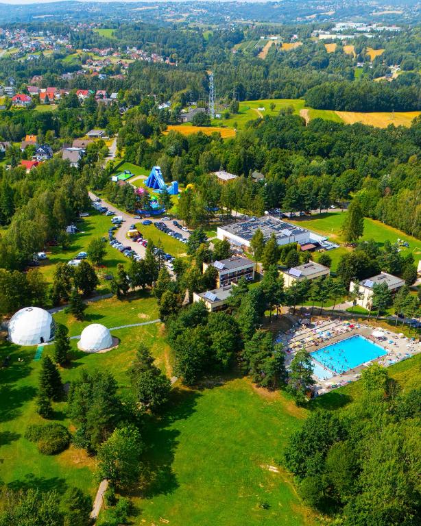 an overhead view of a campground with a pool and tents at Hotel Dobczyce in Dobczyce