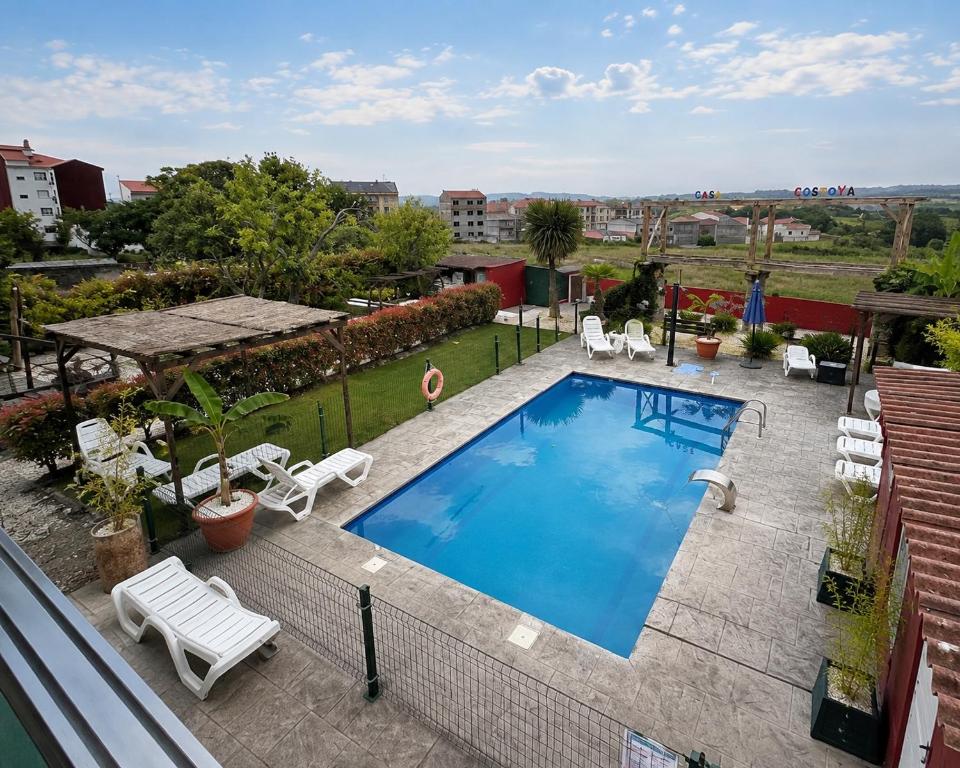a swimming pool on top of a building at Pensión Casa Costoya in Arzúa
