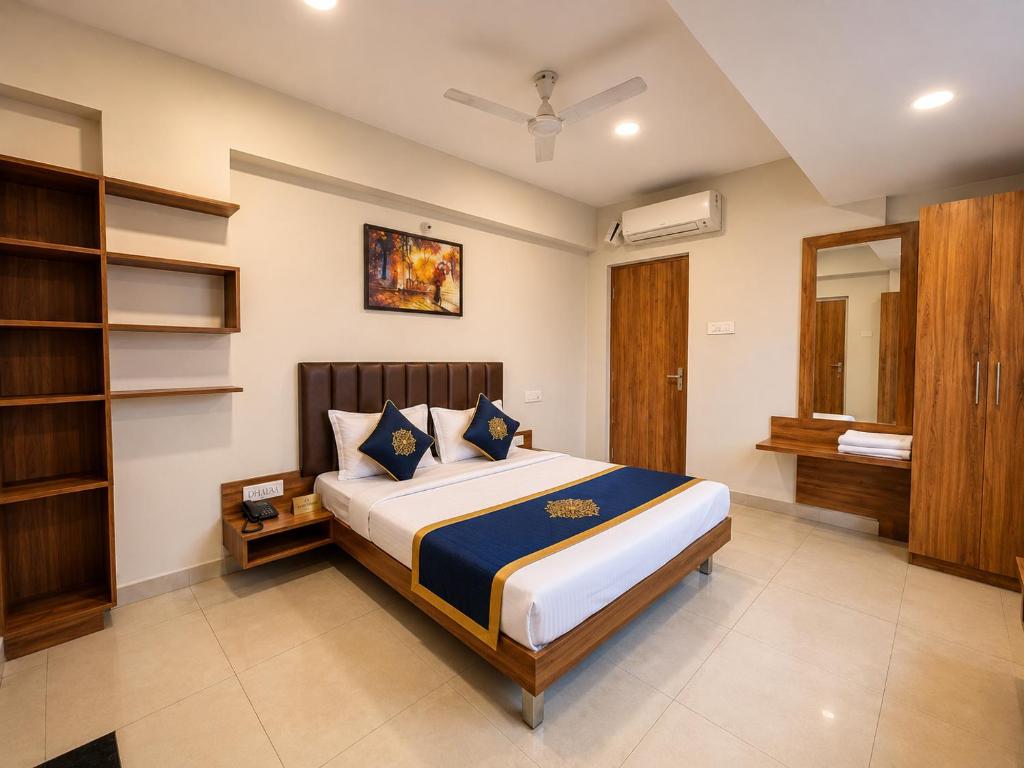 a bedroom with a large bed in a room at TRPOTELS Formerly Hotel Sagar in Gwalior