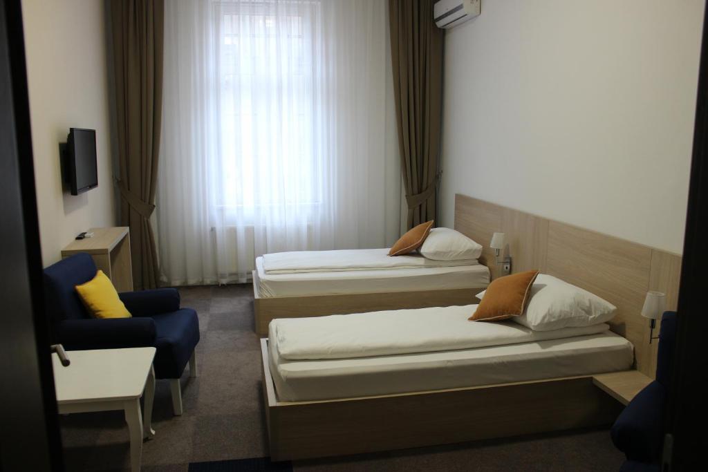 Postel nebo postele na pokoji v ubytování Hotel Story