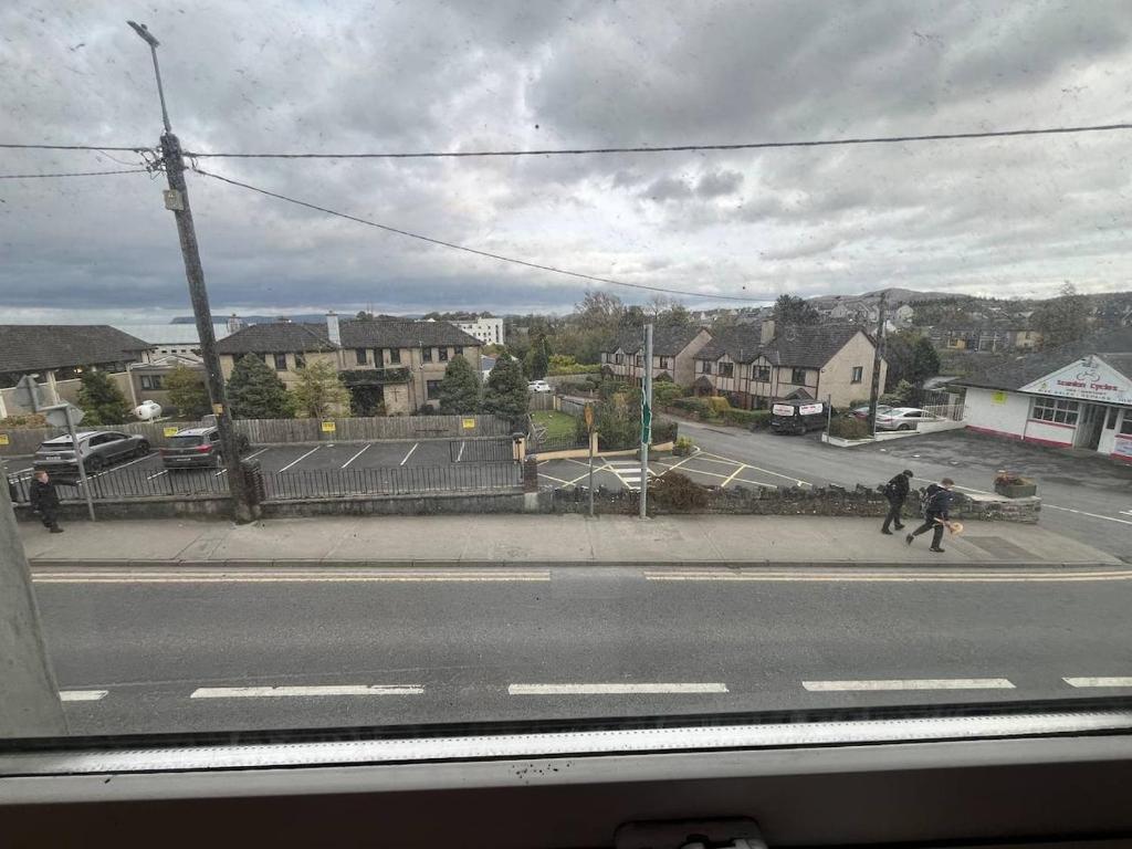 a view of a street with people walking down the street at Bayview in Ballysadare