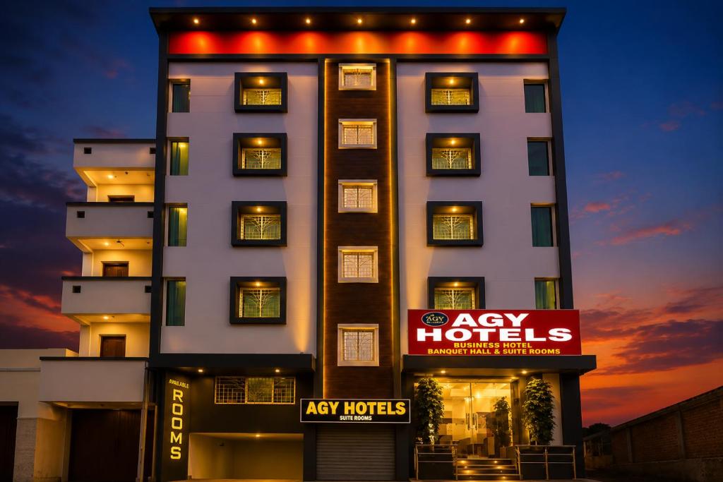 a large building with aady hotels sign in front of it at Agy Hotels in Pune