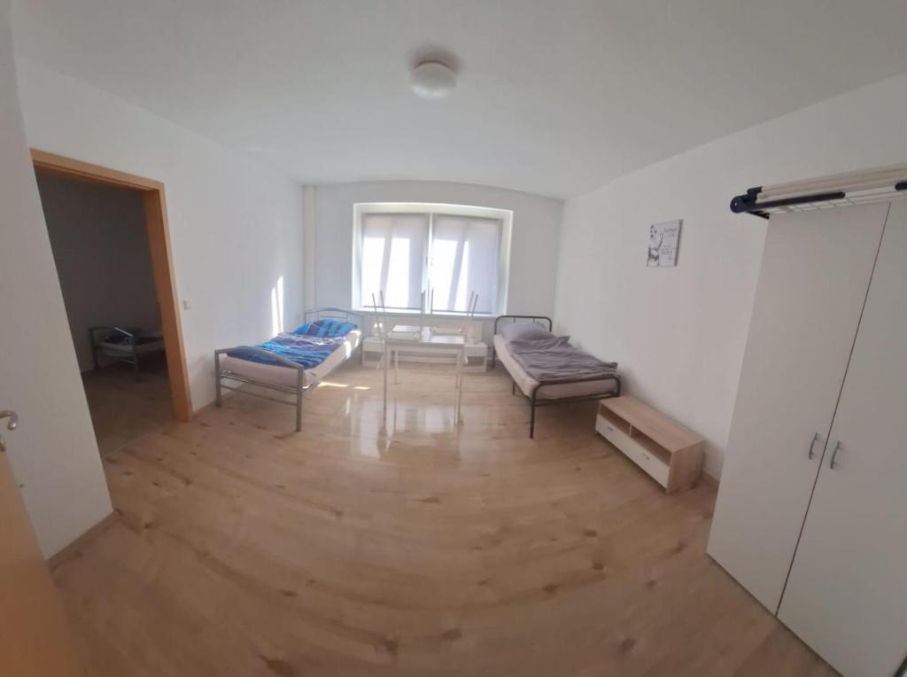 a living room with a couch and a table at Monteurswohnung1 in Halle an der Saale