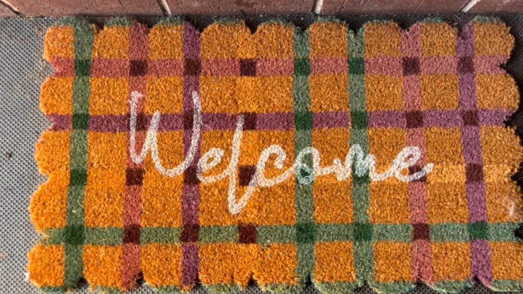 a blanket with the word pumpkin written on it at The Paddocks in Bicton