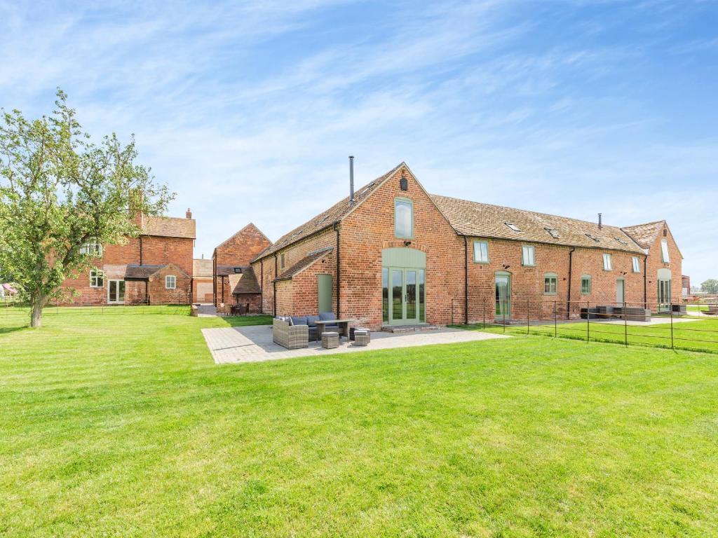 a large brick house with a large yard at The Stables - Uk44139 in Baystonhill